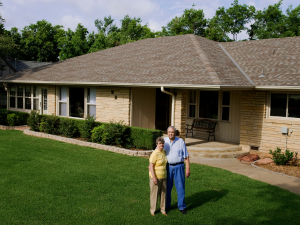 Homeowner in Laurel smiling after a successful gutter leak repair by American Remodeling Corp
