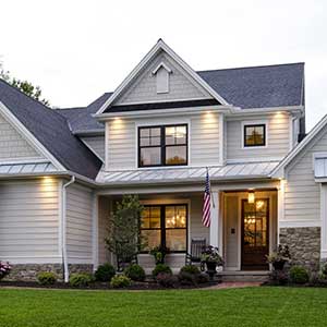 Front view of a home with light gray James Hardie siding